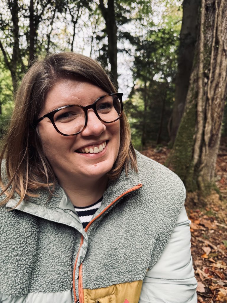 The image is of myself, Nicki, smiling in a woodland. To convey warmth and a welcoming image to counselling.
